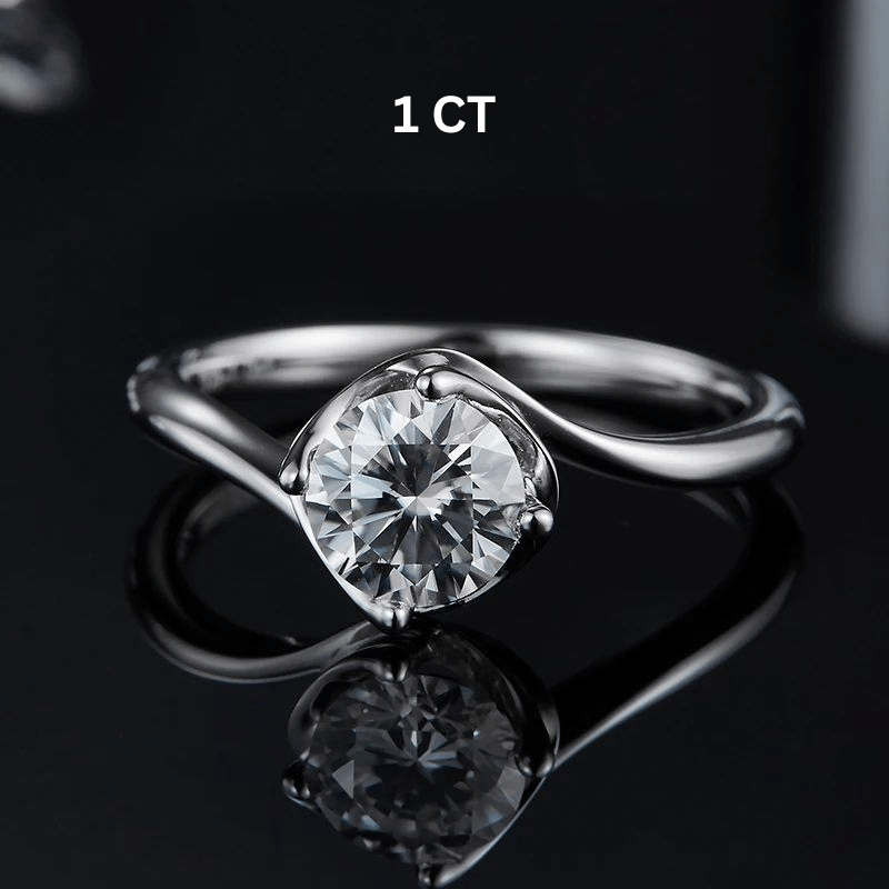 Shop The Zarela Round-Cut Moissanite Ring - 0.5CT or 1.0CT today at Chantal Vaulet. Discover stunning jewelry collections, crafted for style and brilliance.