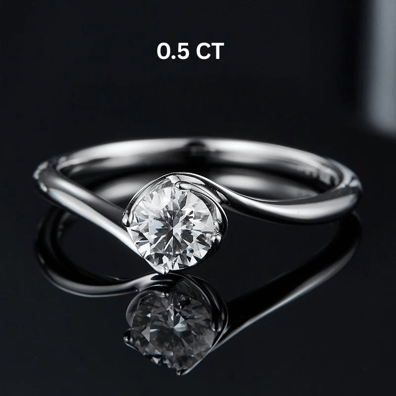 Shop The Zarela Round-Cut Moissanite Ring - 0.5CT or 1.0CT today at Chantal Vaulet. Discover stunning jewelry collections, crafted for style and brilliance.