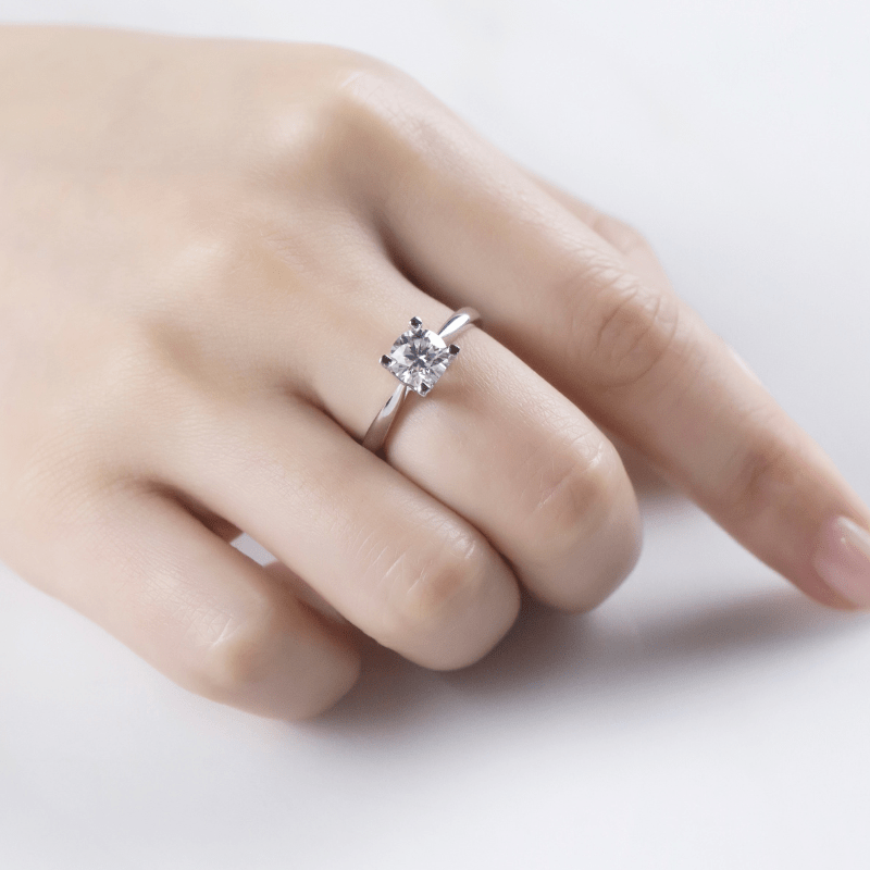 Marcella Moissanite solitaire ring on a hand, showcasing elegance with a 1.0ct stone for engagement 💍✨
