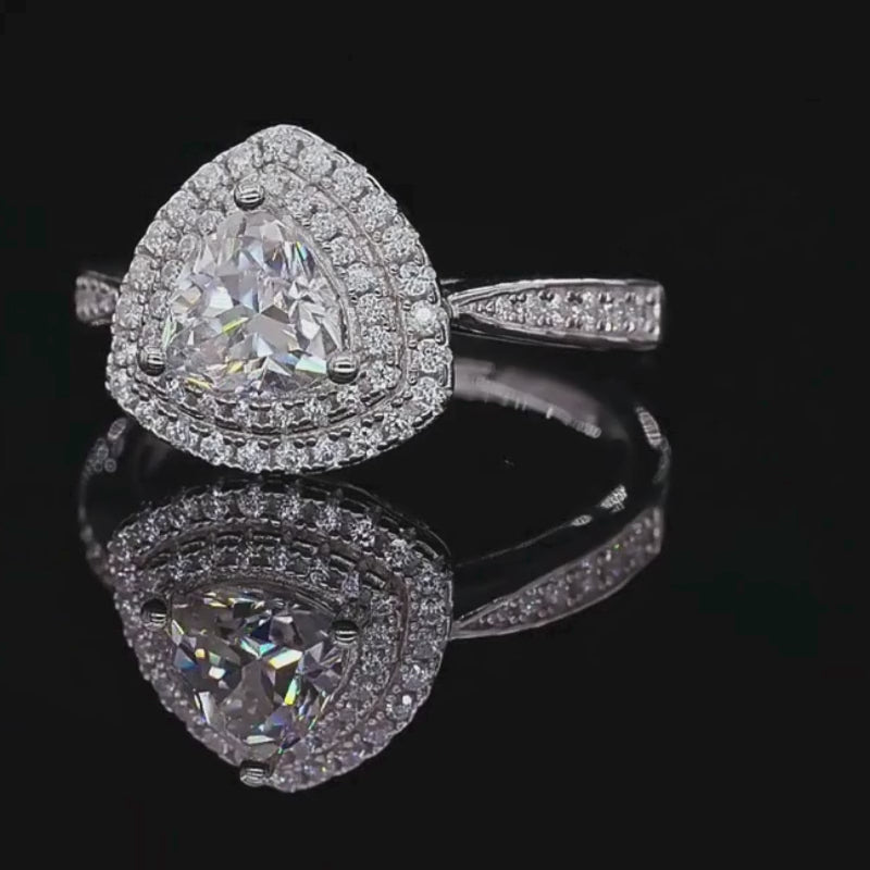 Shop The Ismeria Trillion-Cut Moissanite Halo Ring today at Chantal Vaulet. Discover stunning jewelry collections, crafted for style and brilliance.