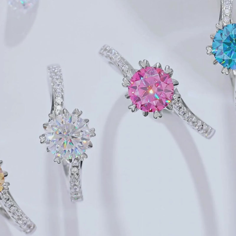 Close-up of colorful rings featuring sparkling round stones and accent gems. 💍✨ Perfect for engagement and weddings!