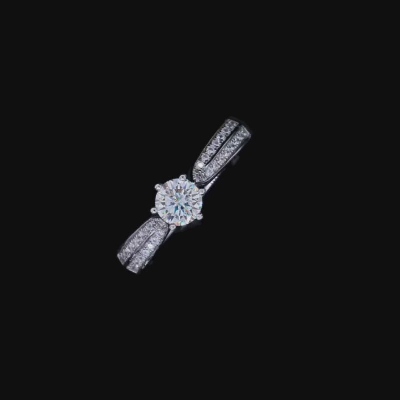 The Seraphielle Moissanite Ring featuring a stunning round-cut center stone and zirconia side stones. 💍✨ #Engagement #Wedding