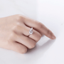 Elegant hand wearing a Solara Moissanite engagement ring 💍✨ showcasing a radiant 1.0ct stone and sleek band.