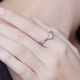 Elegant Alencia Moissanite Twist Ring on hand 💍✨ Perfect for engagement or wedding, showcasing amazing value!