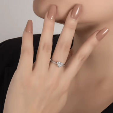 Elegant hand showcasing The Amore Moissanite heart solitaire ring 💍, perfect for engagement or wedding 💖.