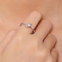 Elegant 0.5CT round-cut Moissanite ring on a hand, perfect for engagement or wedding 💍✨, showcasing amazing value!