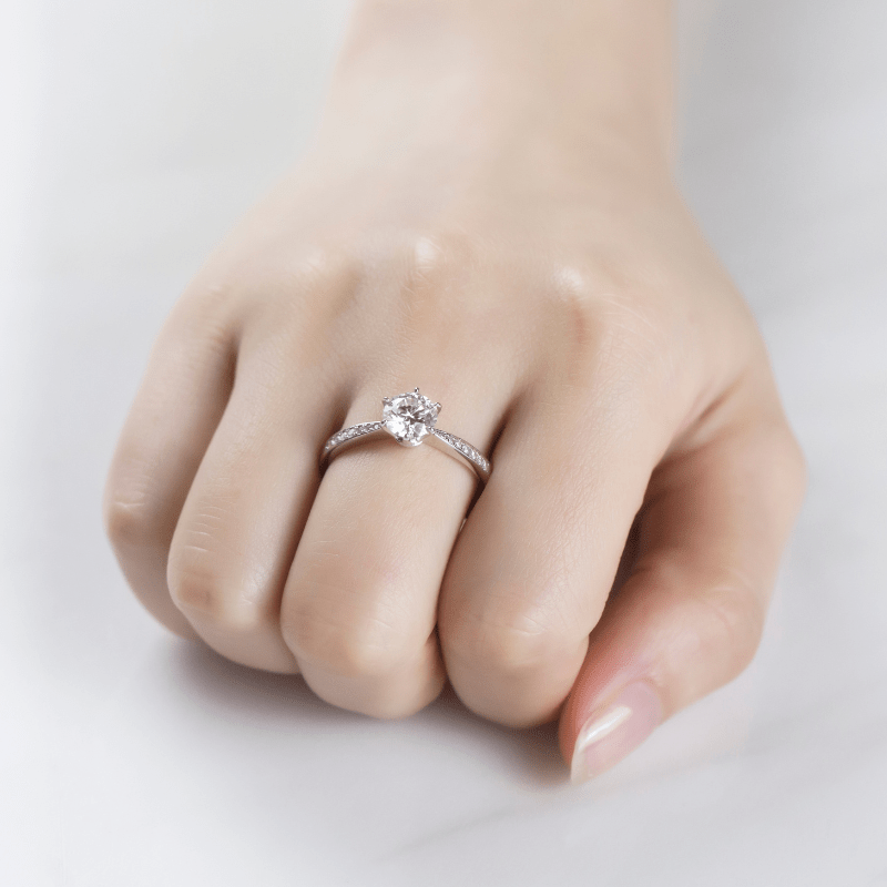 Moissanite engagement ring on hand 💍✨, featuring 1.0CT round-cut center stone and pavé accents - amazing value!