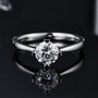 Elegant 1.0 CT round-cut Moissanite ring in polished sterling silver, perfect for engagement or wedding 💍✨. Amazing value!
