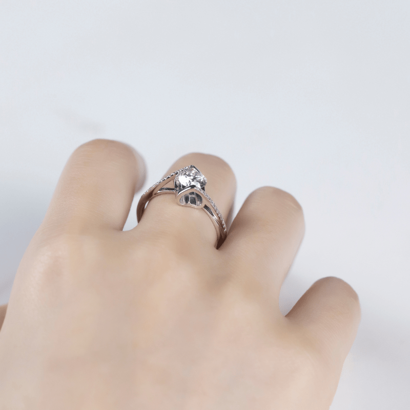 Elegant moissanite engagement ring on hand 💍✨, showcasing a 1.0CT brilliance and modern bypass design. Amazing value!