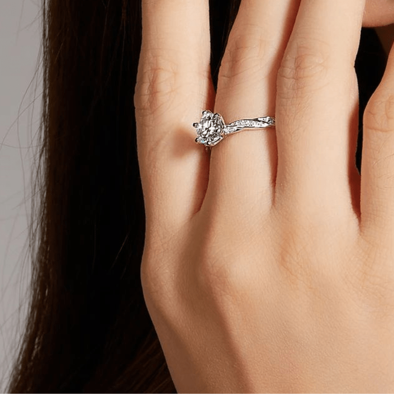 Elegant Calyra Moissanite Twist Ring on a hand, showcasing its stunning 1.0CT round-cut brilliance ✨💍 #Wedding #Engagement