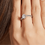 Elantria Moissanite Twist Ring on hand ✨💍, featuring a dazzling 1.0CT round-cut Moissanite and elegant twist design.