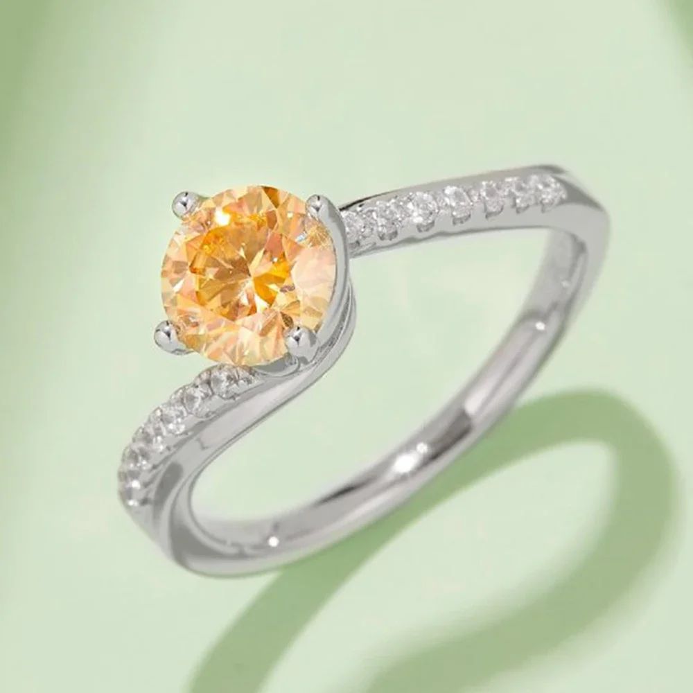 Elegant ring with a round orange stone and shimmering pavé accents, perfect for engagements💍✨. Amazing value!