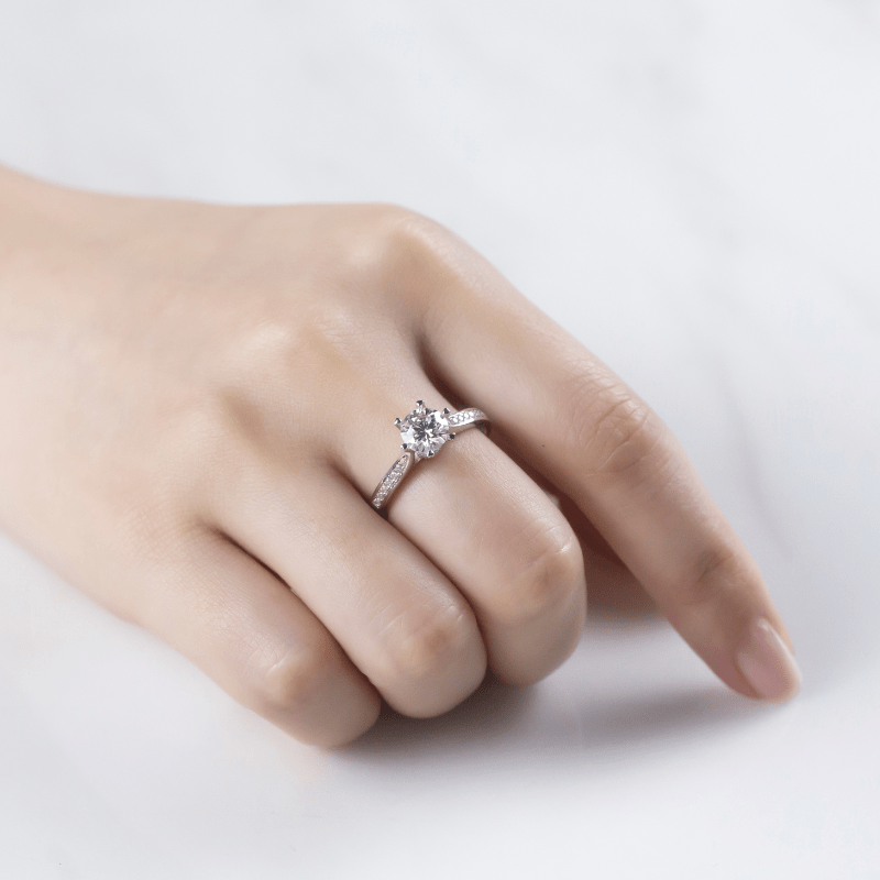 Hand wearing The Elvanna Moissanite Pavé Ring 💍✨, perfect for engagement or wedding, showcasing amazing value!
