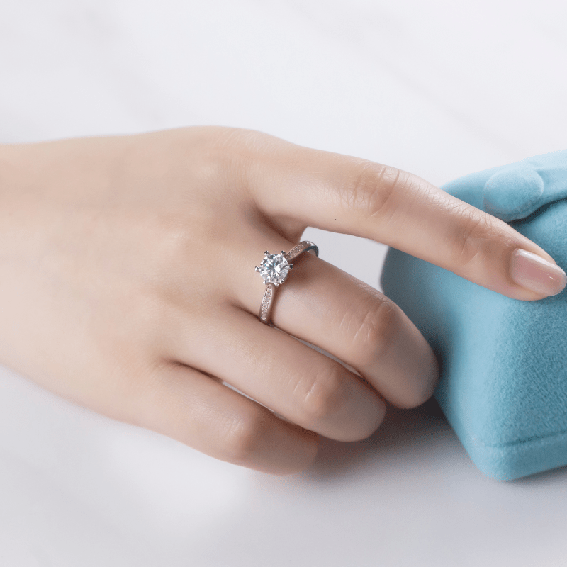 Elegant hand showcasing The Elvanna Moissanite Pavé Ring 💍✨, a stunning engagement choice with amazing value!