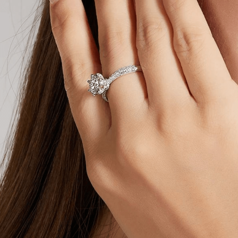 Stunning Moissanite floral engagement ring on a hand, featuring a 1.0CT stone and 87 pavé-set accents. 💍✨ #AmazingValue