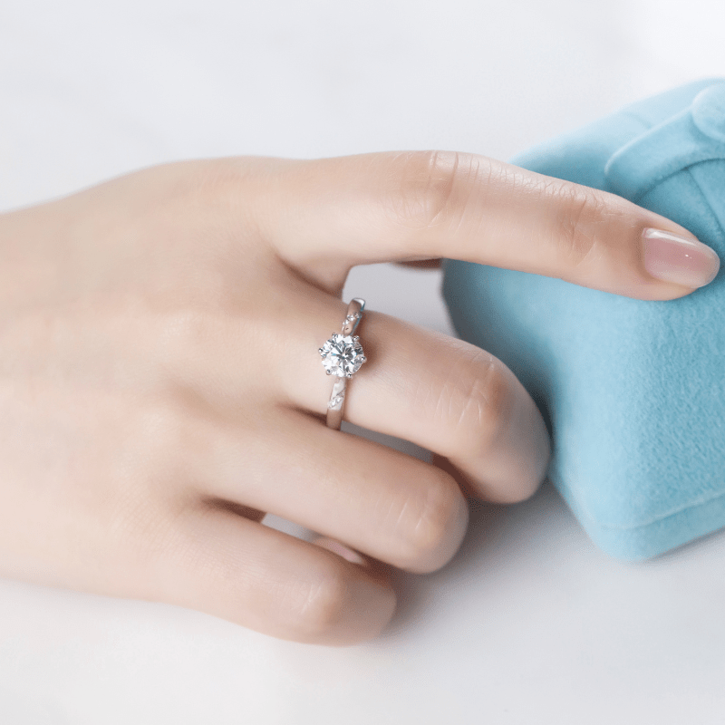 Elegant Moissanite solitaire ring on a hand, symbolizing engagement and wedding 💍✨. Amazing value and timeless design.
