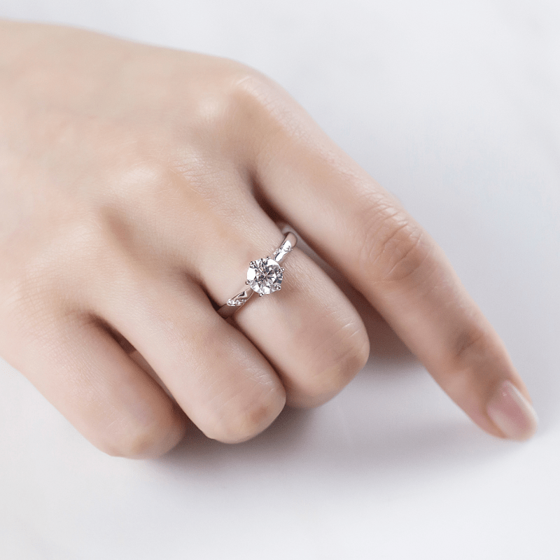 Elegant hand wearing The Evanna Moissanite solitaire ring 💍 1.0ct, perfect for engagement or wedding, amazing value!