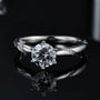 Elegant Moissanite solitaire ring with a 1.0ct center stone and sparkling accent stones. 💍✨ Perfect for engagements and weddings!