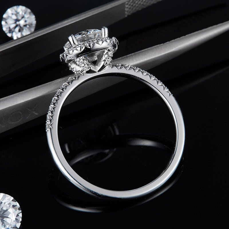 Evelora Moissanite Halo Ring 💍✨ featuring a 1.0CT center stone, surrounded by brilliant pavé settings. Perfect for engagements!