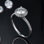 Evelora Moissanite Halo Ring 💍✨ featuring a 1.0CT round Moissanite and 42 pavé stones, perfect for engagement or wedding.