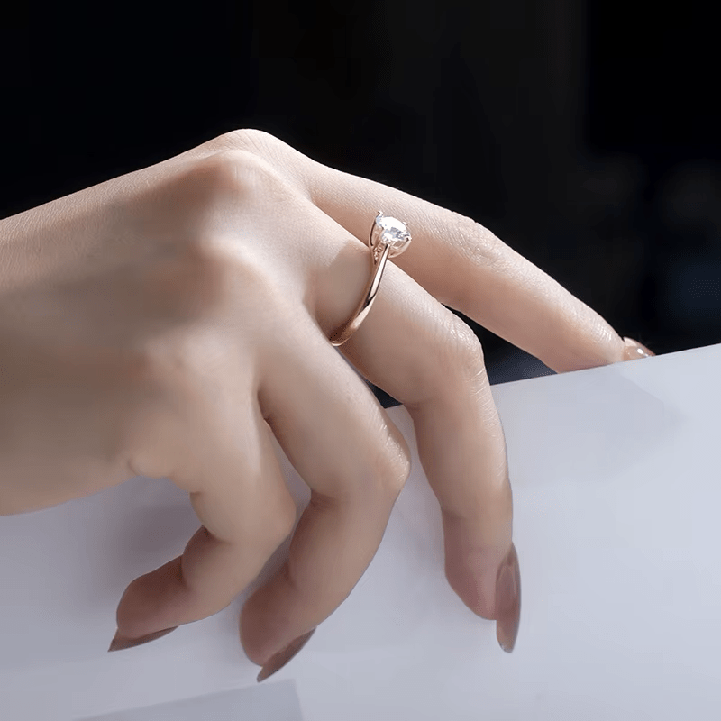 Elegant hand wearing The Everly Moissanite solitaire ring 💍✨, perfect for engagements and weddings, an amazing value!