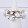 Elegant stack of Moissanite rings featuring brilliant round cuts in gold and silver, perfect for engagement or wedding 💍✨