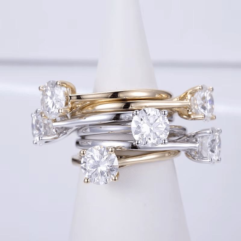 Elegant stack of Moissanite rings featuring brilliant round cuts in gold and silver, perfect for engagement or wedding 💍✨