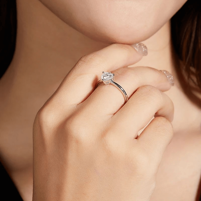 Stunning hand wearing The Fiorella Moissanite 1.0CT ring 💍, perfect for engagements or weddings with amazing value! ✨