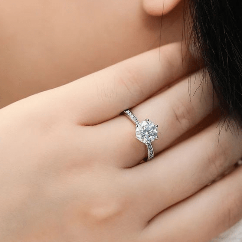 Elegant Moissanite engagement ring on a hand, showcasing its stunning brilliance and amazing value 💍✨