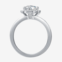 The Orliana Moissanite Halo Ring 💍 features a stunning round-cut stone and elegant pavé accents. Perfect for engagements!✨