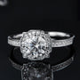 Stunning Orliana Moissanite Halo Ring 💍✨ featuring a 1.0CT round Moissanite and a unique scalloped halo. Perfect for engagement or wedding!