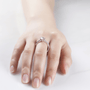 Elegant hand wearing The Selene Moissanite engagement ring 💍✨, showcasing its captivating sparkle and modern design.