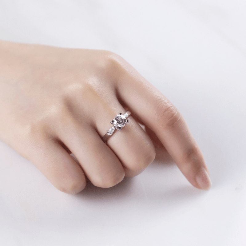 🌟 The Seraphine Moissanite Engagement Ring sparkles on a hand, showcasing elegance for weddings & special moments! 💍✨