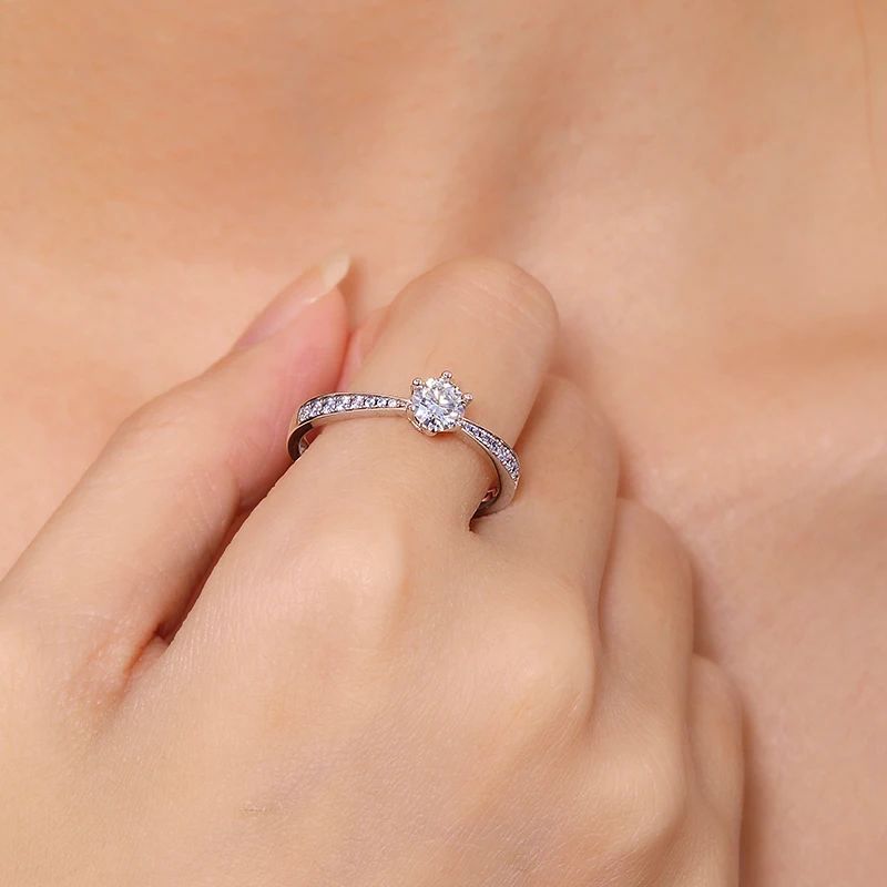 Elegant Moissanite solitaire ring on a hand, perfect for engagements 💍✨ - an amazing value piece!