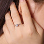 Woman wearing The Solaya 0.5CT Moissanite Ring in polished silver ✨💍 Perfect for engagement or wedding!