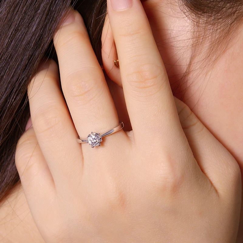 Woman wearing The Solaya 0.5CT Moissanite Ring in polished silver ✨💍 Perfect for engagement or wedding!