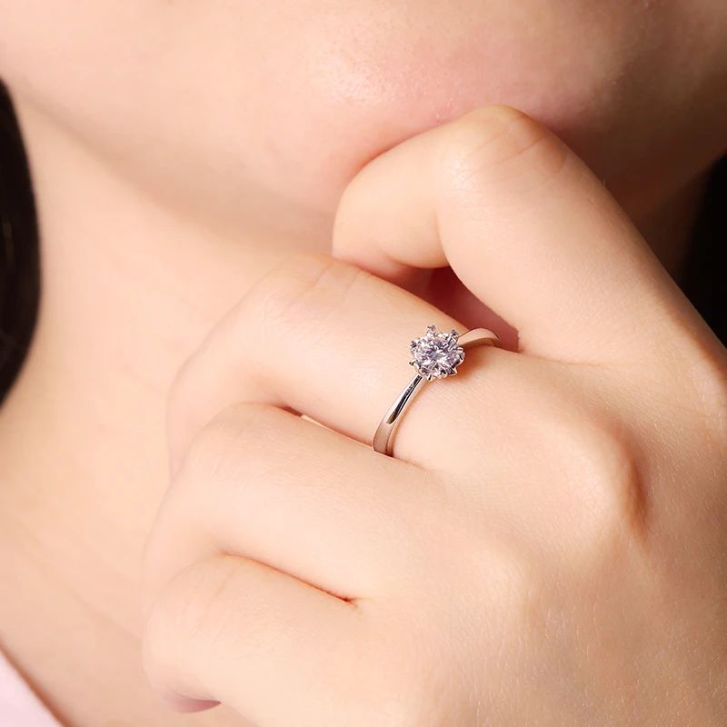 Elegant hand wearing The Solaya 0.5CT Moissanite Ring 💍✨, perfect for engagements or weddings! #Moissanite #Luxury