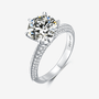 Stunning Valmora 3CT round-cut Moissanite ring 💍✨ with zirconia embellishments, perfect for weddings and engagements!