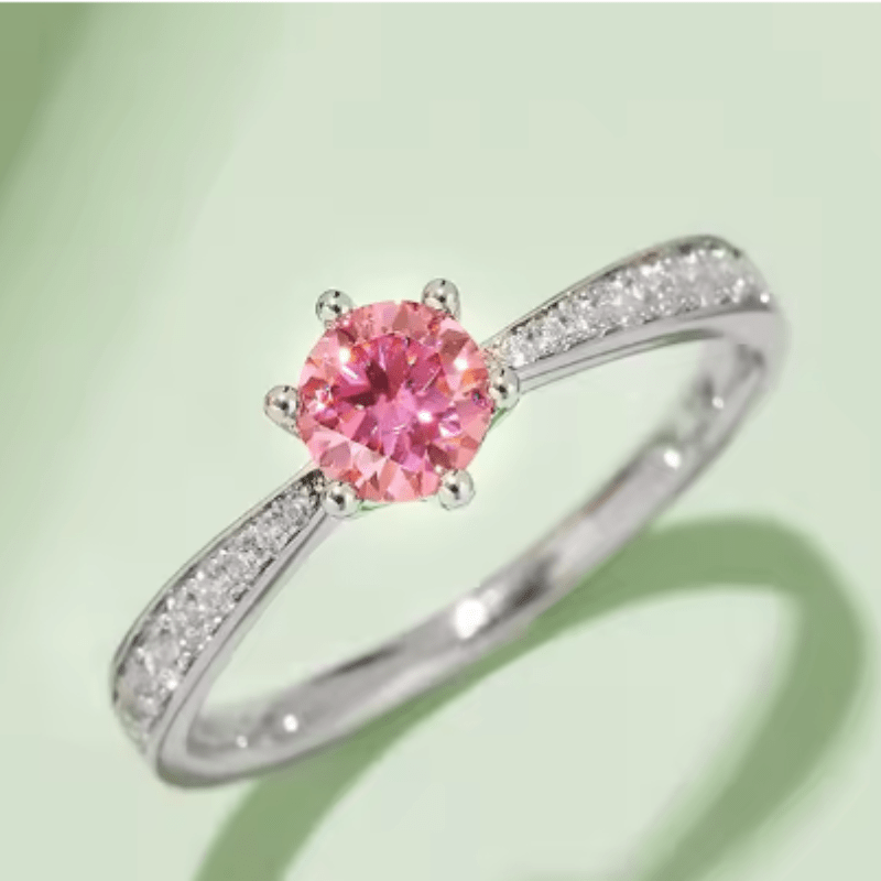 Stunning pink gemstone ring with diamond accents, perfect for engagement or wedding. 💍✨ Elegant and classy choice!