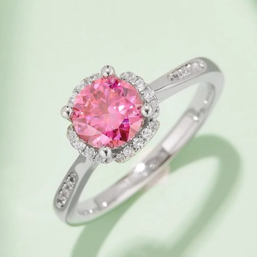 Stunning pink gemstone ring with halo and pavé accents. Perfect for engagement or wedding! 💍✨ #AmazingValue #Moissanite