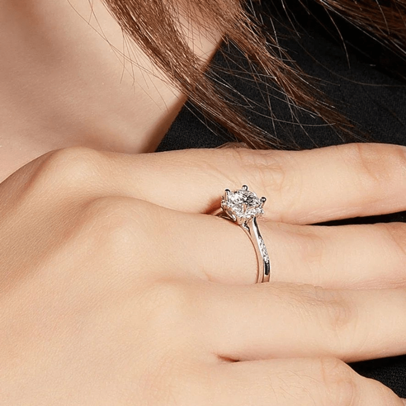 Elegant Moissanite halo engagement ring on hand 💍, showcasing beauty and amazing value for weddings.