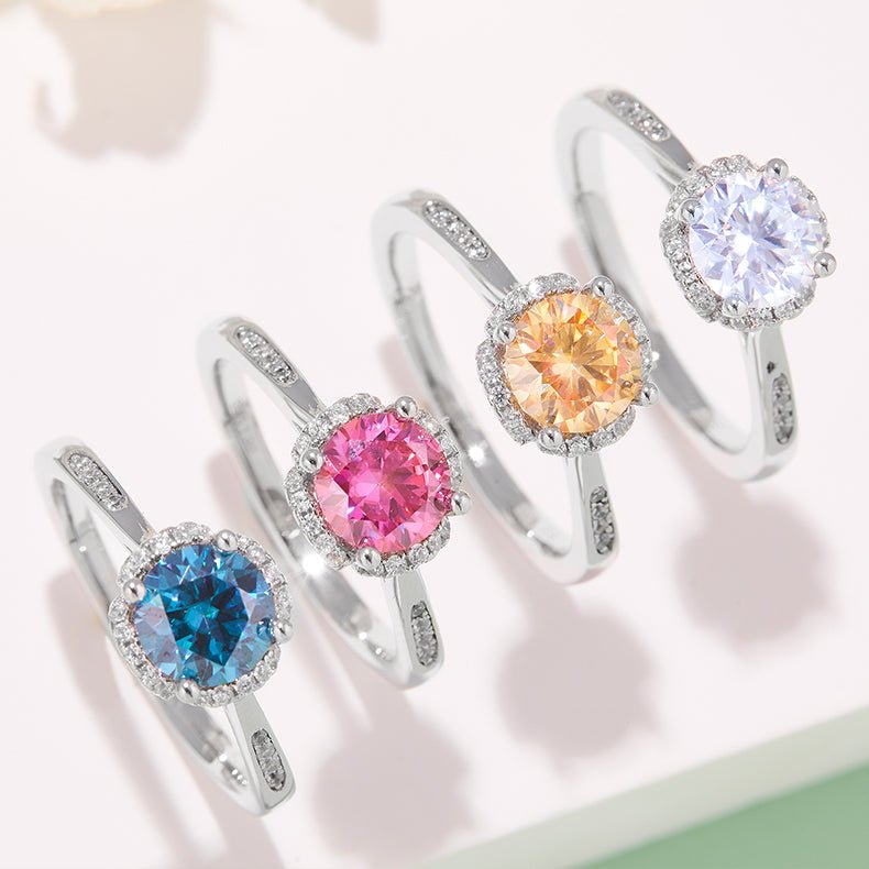 Colorful gemstone rings with halo settings 💍✨, featuring blue, pink, orange, and clear stones, perfect for engagement or wedding.