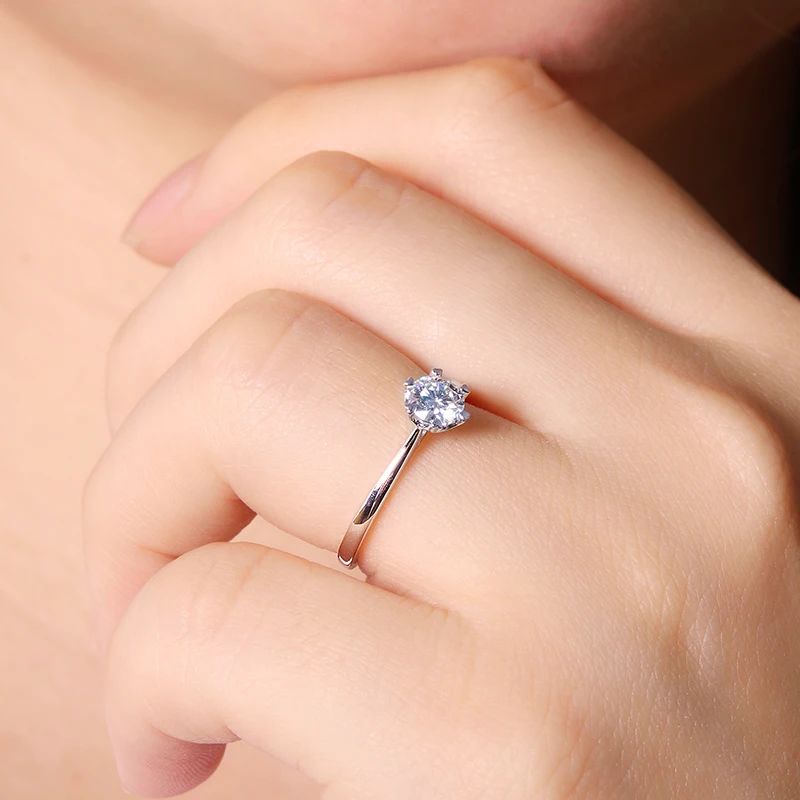 Stunning 0.5CT round-cut Moissanite ring on a hand 💍✨ Perfect for engagements and weddings at amazing value!