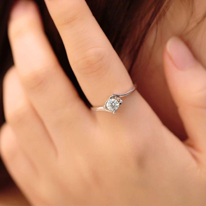 Close-up of a hand wearing The Virella 0.5CT Moissanite ring, showcasing its brilliant sparkle and modern design. 💍✨ #Moissanite #Engagement
