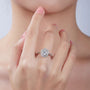 Beautiful woman wearing the Vivienne Oval-Cut Moissanite Halo Ring, perfect for engagements and weddings. 💍✨ #Moissanite #AmazingValue