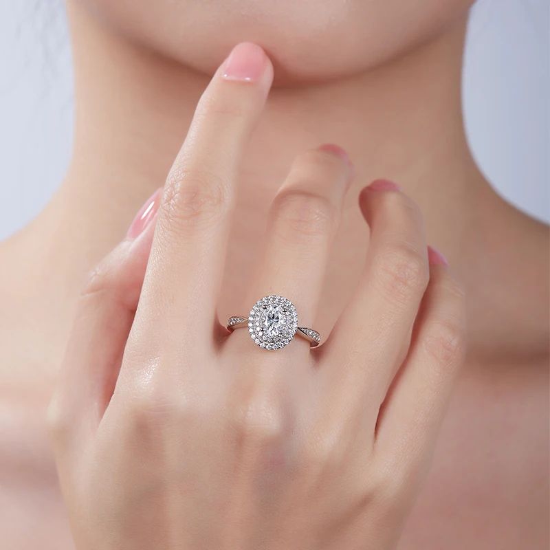Beautiful woman wearing the Vivienne Oval-Cut Moissanite Halo Ring, perfect for engagements and weddings. 💍✨ #Moissanite #AmazingValue