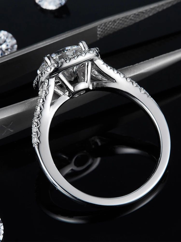 Close-up of The Zalenka 3CT round-cut Moissanite ring, showcasing its sterling silver band and stunning pavé effect ✨💍.